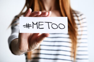 Woman holding a sign that says #MeToo. sexual assault case lawyer Jacobs Injury Law.