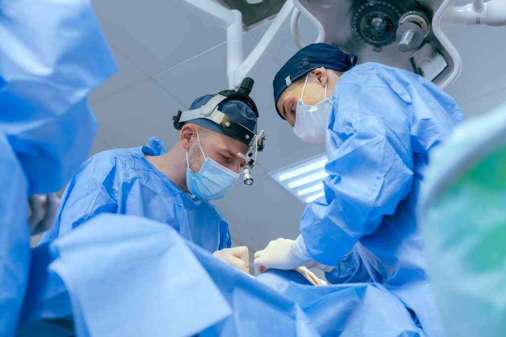 Doctors in operating room indicating the possible need for a medical malpractice lawyer